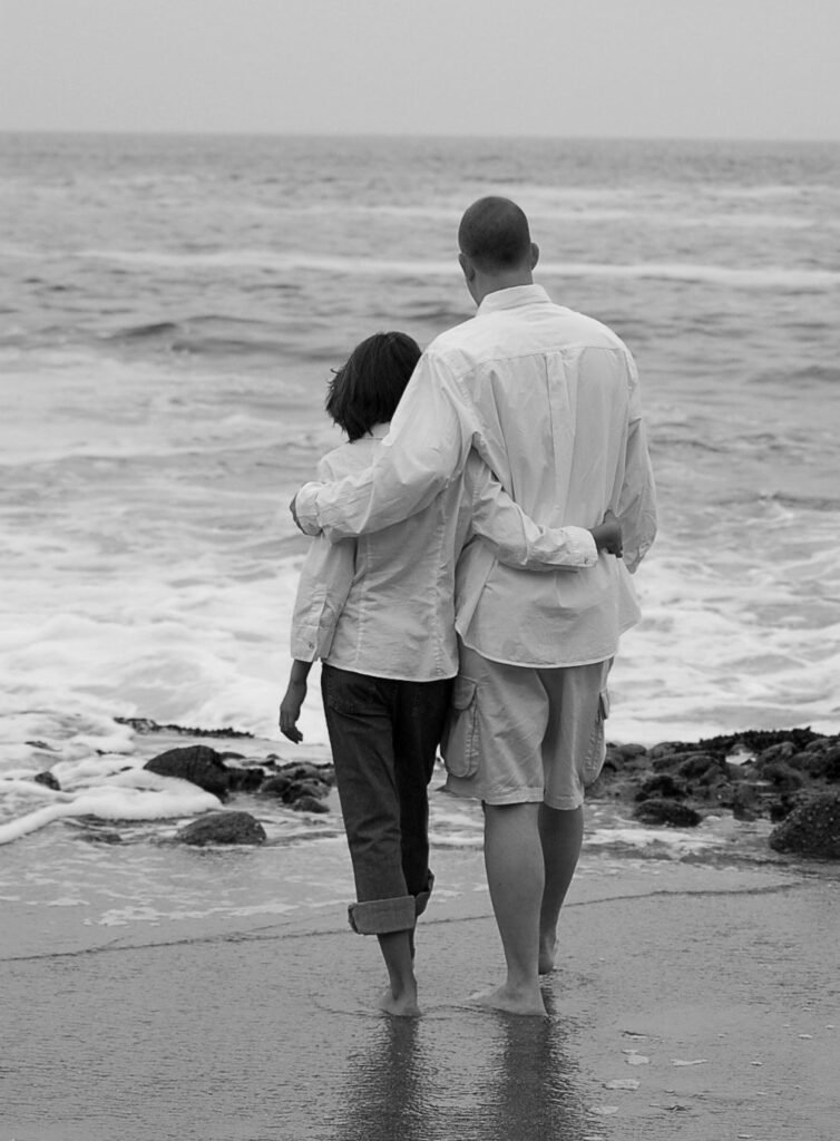 Peter Pendleton walking on the beach with family