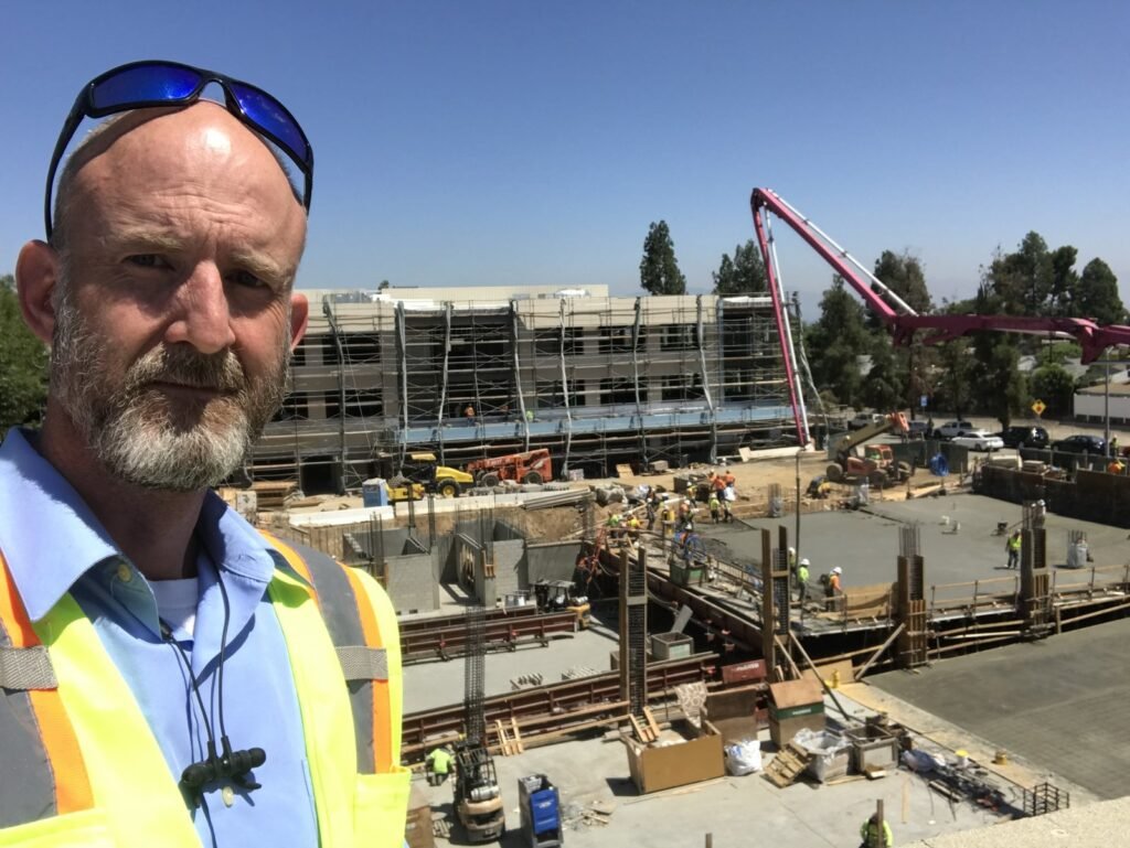 Peter Pendleton on site during a deck pour with a boom pump